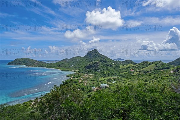 View over Chatham Bay and green hills on Union Island