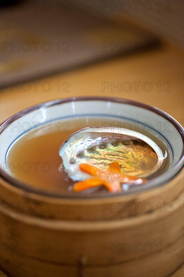 Japanese style abalone soup empty shell on bamboo bowl set holder