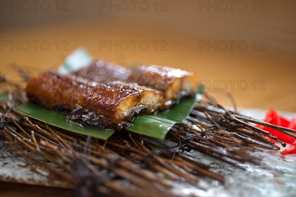 Japanese style roasted eel served on palm leaf