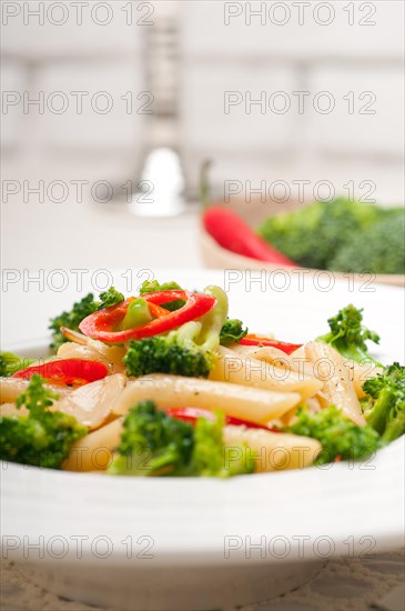 Classic Italian penne pasta with broccoli and red chili pepper