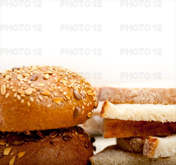 Fresh organic bread over rustic table macro closeup