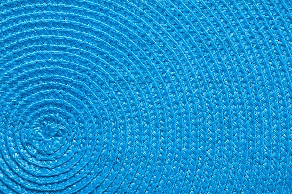 Close-up of the blue texture of a braided mat