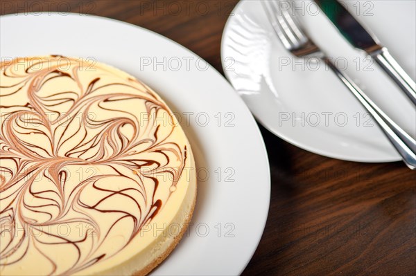 Fresh baked classic Cheese cake with chocolate topping