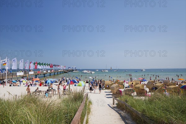 Roofed wicker beach chairs along the Baltic Sea at Scharbeutz