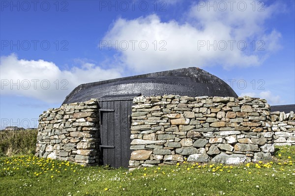 Boat-roofed shed at the Croft House Museum