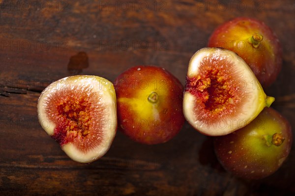 Fresh figs macro closeup over old wood boards