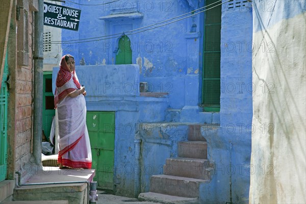 Woman wearing traditional sari in the blue city of Jodhpur