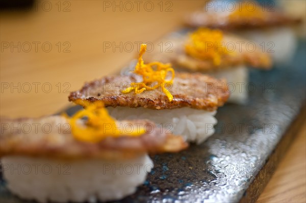 Japanese style sushi fried goose liver macro closeup