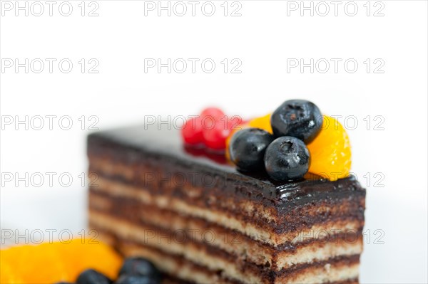 Chocolate cake and fresh fruit on top closeup macro