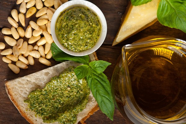 Italian basil pesto bruschetta ingredients over old wood macro