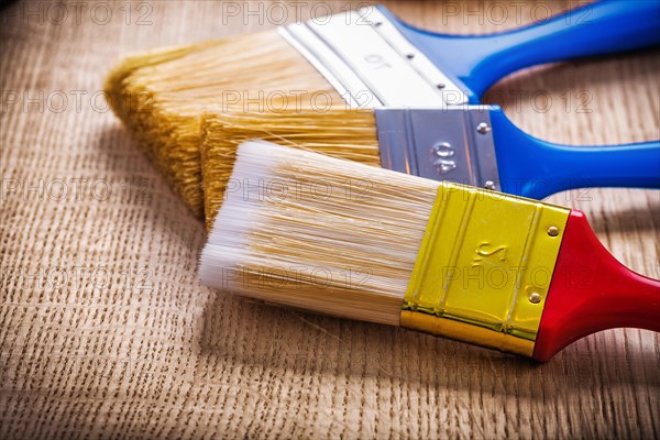 Close-up of the bristles of a paintbrush on a wooden board