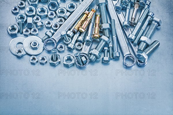 Anchor bolts Washers Bolts Construction Nuts and flat spanners on metallic background Repair concept