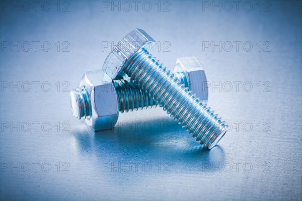 Metal bolt Details with screw nut on metallic background Construction concept