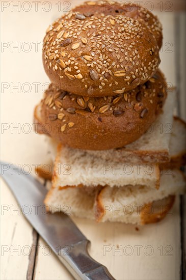 Fresh organic bread over rustic table macro closeup