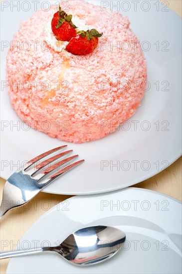 Fresh pink strawberry and whipped cream dessert macro close up