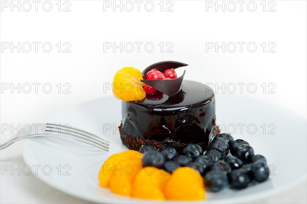 Chocolate cake and fresh fruit on top closeup macro