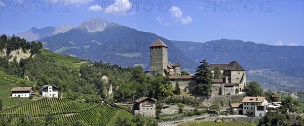 The castle Schloss Tirol and apple orchard at Tirolo