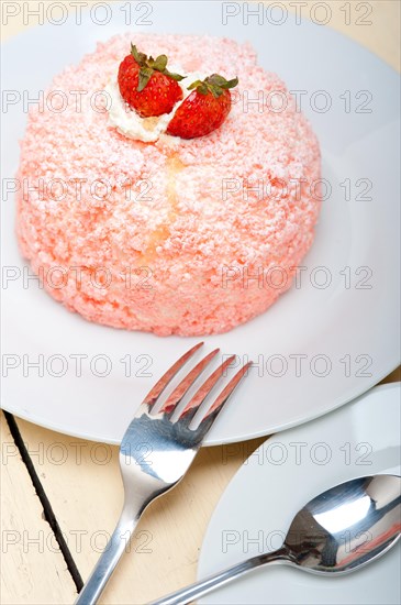 Fresh pink strawberry and whipped cream dessert macro close up