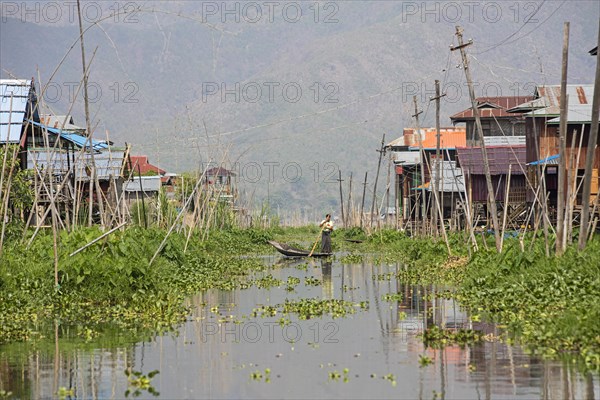 Traditional wooden houses on stilts in Inle Lake