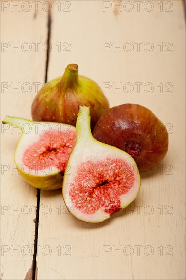 Fresh ripe figs on a rustic white table