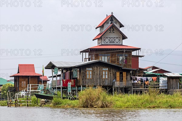 Traditional wooden houses on stilts in Inle Lake