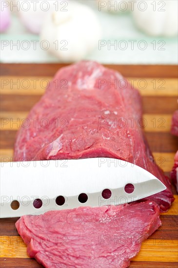 Raw beef cutting on wood board ready to cook