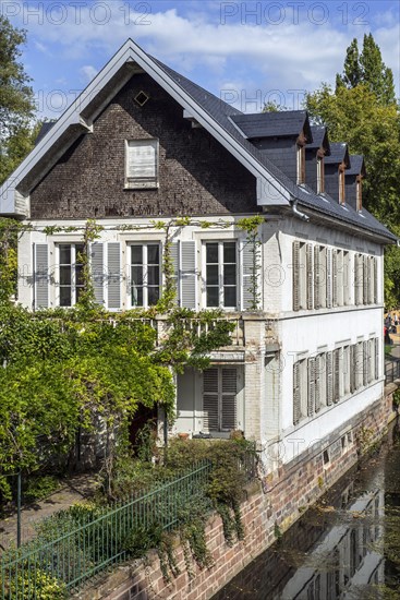 Picturesque bierstub on the river Ill in the Petite France quarter of the city Strasbourg