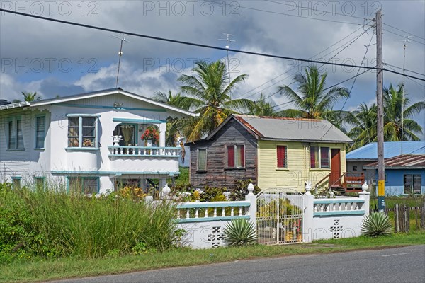 Rural village with traditional wooden houses in the countryside of Guyana