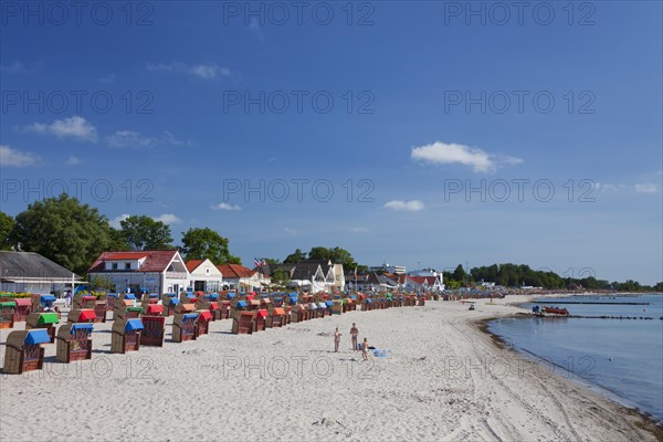 Roofed wicker beach chairs along the Baltic Sea at Kellenhusen