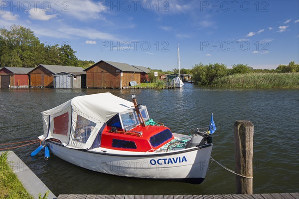 Wooden boat houses on the banks of the Plauer See at Plau am See