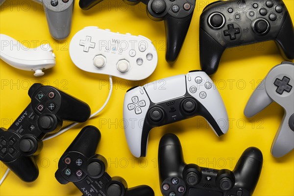 Different generations of Playstation and Nintendo game controllers