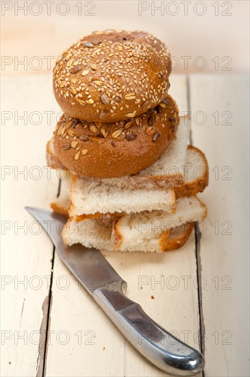 Fresh organic bread over rustic table macro closeup