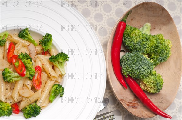 Classic Italian penne pasta with broccoli and red chili pepper