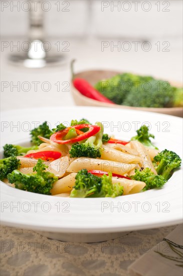 Classic Italian penne pasta with broccoli and red chili pepper