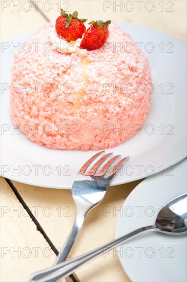 Fresh pink strawberry and whipped cream dessert macro close up