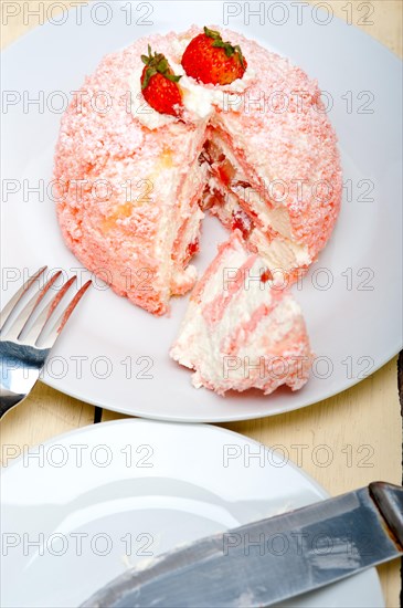 Fresh pink strawberry and whipped cream dessert macro close up