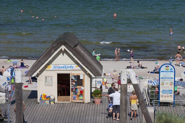 Cabin renting out roofed wicker beach chairs along the Baltic Sea at Scharbeutz