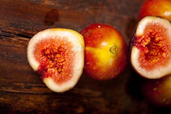 Fresh figs macro closeup over old wood boards