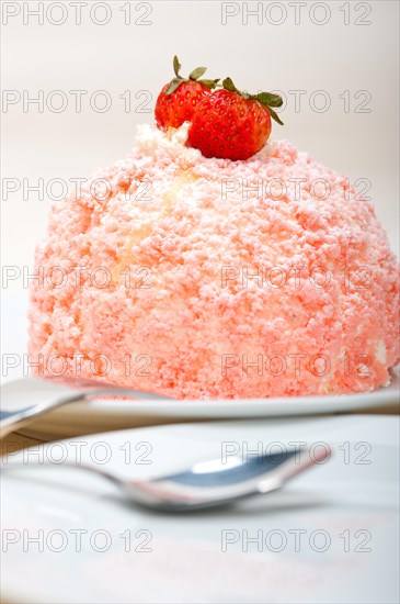 Fresh pink strawberry and whipped cream dessert macro close up