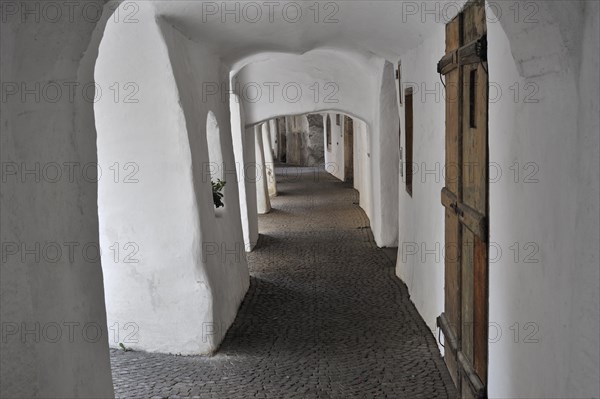 Arcade covered sidewalk pavement along the Laubengasse at Glorenza