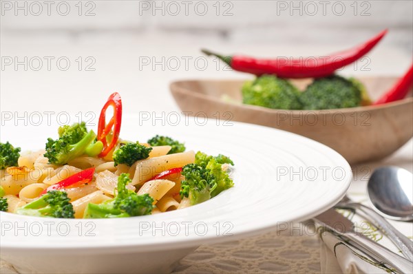 Classic Italian penne pasta with broccoli and red chili pepper