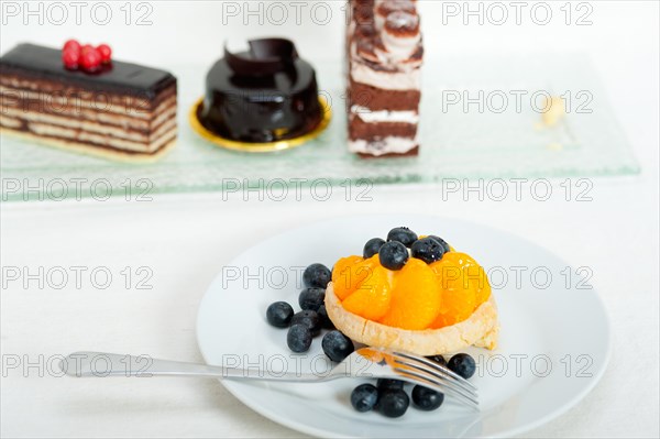 Fresh blueberry and tangerine orange cream cupcake homemade closeup macro