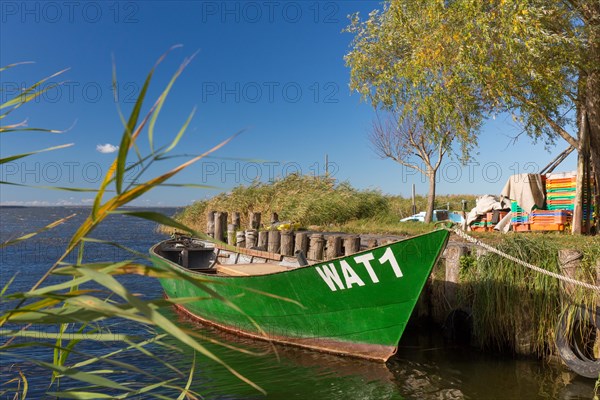 Fishing boat in small harbour of the Achterwasser at Warthe near Rankwitz on Usedom island in the Baltic Sea
