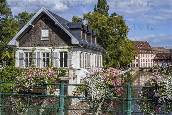 Picturesque bierstub on the river Ill in the Petite France quarter of the city Strasbourg