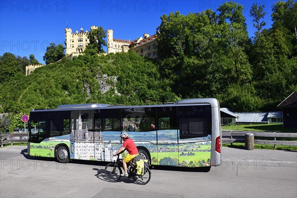 Cyclist in front of Hohenschwangau Castle