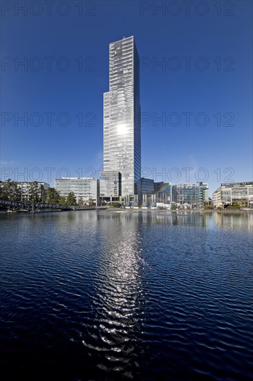 Cologne Tower reflected in the Mediapark Lake