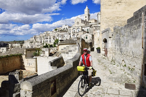 Cyclist with touring bike in the old town