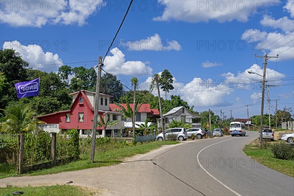 Wooden houses and road winding through the village Groningen in the Saramacca District