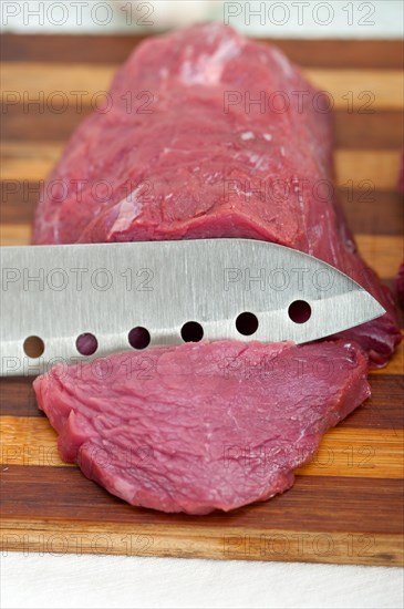 Raw beef cutting on wood board ready to cook