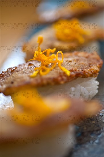 Japanese style sushi fried goose liver macro closeup